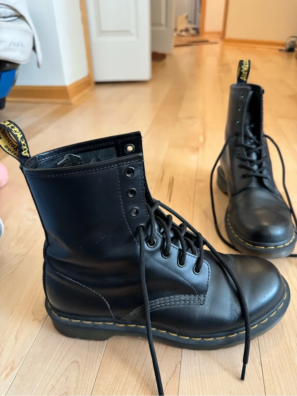 Dr. Martens Black Leather Lace-Up Boots with Yellow Heel Loop and Stitching